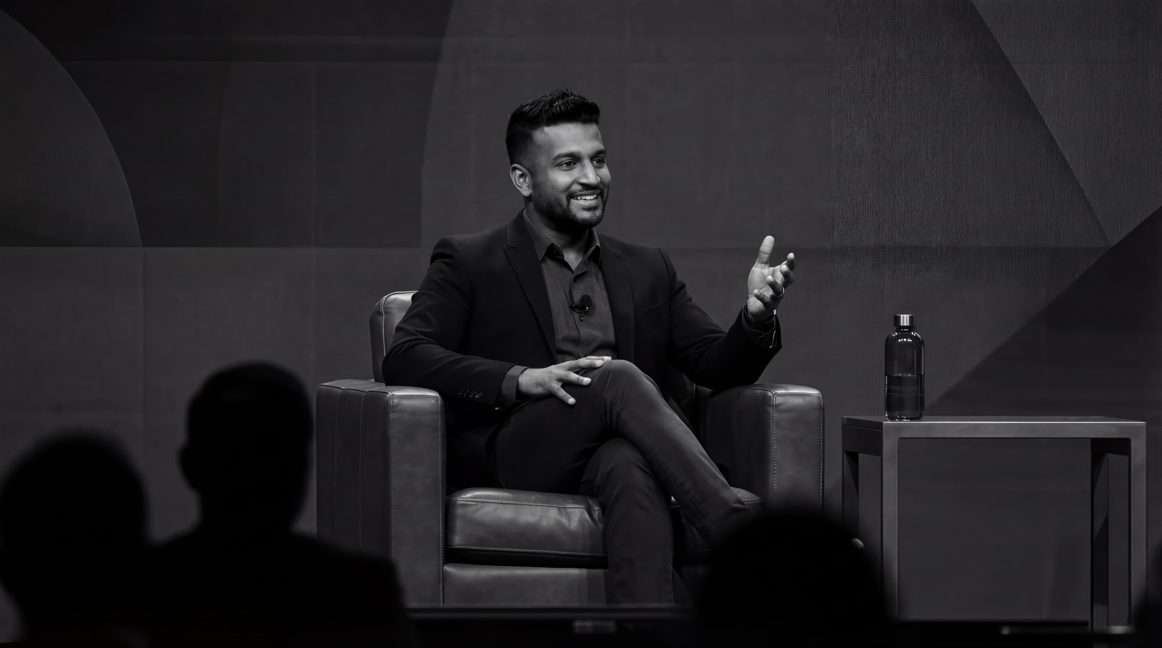 Arunan Kuven speaking on stage